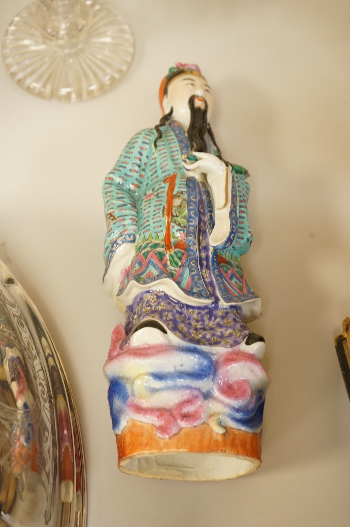 A Chinese enamelled porcelain figure of an immortal, Republic period, 32.5cm high